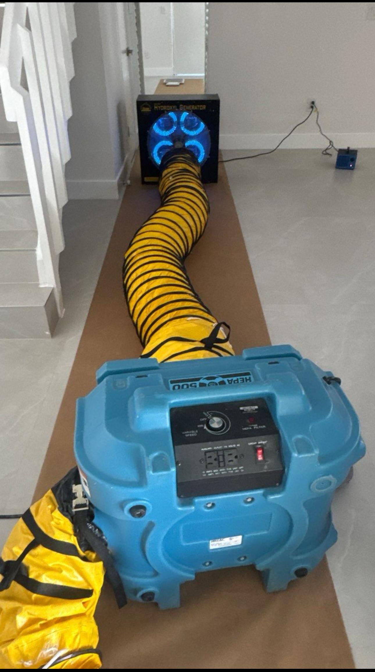 HEPA air filtration machine deployed during mold remediation in a residential property.